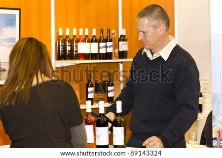 BUDAPEST, HUNGARY - NOVEMBER 19: Unidentified exhibitors on  the 1st Taste and Wine Exposition - Hungexpo on November 19, 2011 in Budapest, Hungary.