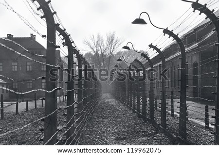 OSWIECIM, POLAND - OCTOBER 22: Electric fence in Auschwitz I, a former Nazi extermination camp on October 22, 2012 in Oswiecim, Poland. It was the biggest nazi concentration camp in Europe.