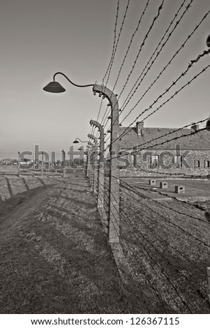 OSWIECIM, POLAND - OCTOBER 22: Barbed wire in Auschwitz Camp II, a former Nazi extermination camp on October 22, 2012 in Oswiecim, Poland. It was the biggest nazi concentration camp in Europe.