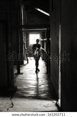 OSWIECIM, POLAND - OCTOBER 22: Visitor in Auschwitz Camp II, a former Nazi extermination camp on October 22, 2012 in Oswiecim, Poland. It was the biggest nazi concentration camp in Europe.