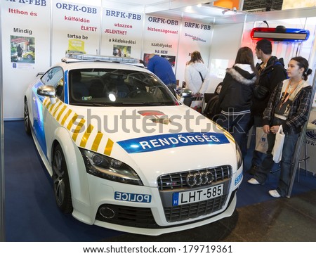 BUDAPEST, HUNGARY - MARCH 1: Unidentified people watching police car on the 37th Travel International Tourist Exposition, largest fair its kind in Central Europe  on March 1, 2014 in Budapest, Hungary