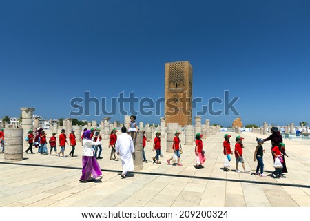 RABAT, MOROCCO - JULY 24 : Children in front of the Hassan Tower and Mausoleum of Mohammed V. Mausoleum contains tombs of late King Hassan II and Prince Abdallah. On July 24, 2014 in Rabat, Morocco