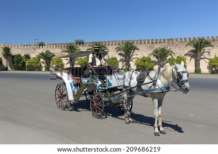 MEKNES, MOROCCO - JULY 24: Carriage at the wall of the Royal Palace on July 24, 2014 in Meknes, Morocco. Meknes is a 1000 years old imperial city.