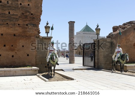 RABAT, MOROCCO - JULY 24 : Royal guards in front of the Hassan Tower and Mausoleum of Mohammed V. Mausoleum contains tombs of late King Hassan II and Prince Abdallah on July 24, 2014 in Rabat, Morocco