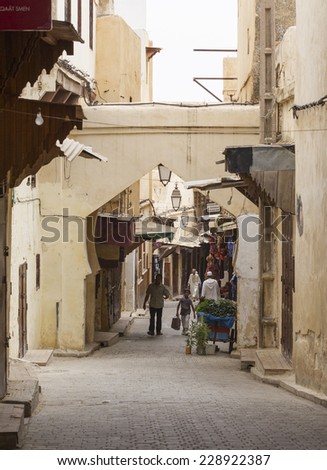 FEZ, MOROCCO - JULY 19: People in the medina on July 19, 2014 in Fez, Morocco.The medina is listed as a UNESCO World Heritage Site and is believed to be one of the world\'s largest car-free urban areas
