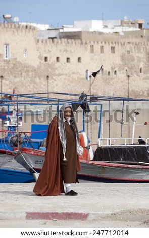 BIZERTE, TUNISIA - FEBRUARY 6: Traditional clothed man in the medina of the city on February 6, 2009 in Bizerte, Tunisia. Bizerte is known as the oldest and most European city in Tunisia.