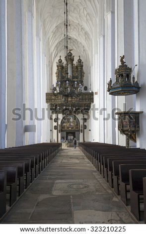 GDANSK, POLAND - SEPTEMBER 20, 2015: Interior of Basilica of Assumption of Blessed Virgin Mary,  Roman Catholic church in Gdansk, Poland, and is currently the largest brick church in the world.