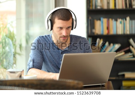 Similar – Image, Stock Photo Man with headphones working on computer