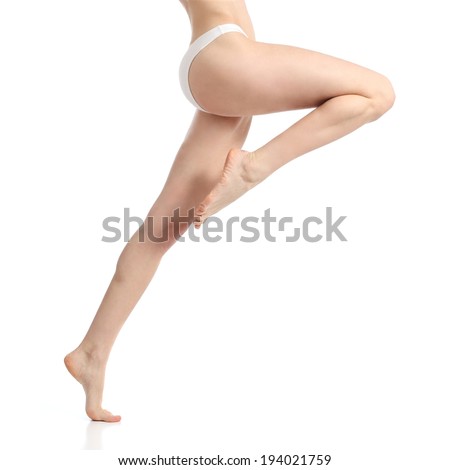 Waxing smooth woman legs posing standing isolated on a white background