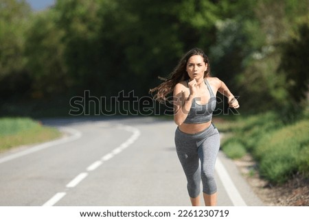 Similar – Image, Stock Photo Girl running towards the sea on the beach of the Baltic Sea with a yellow swimming ring on her back