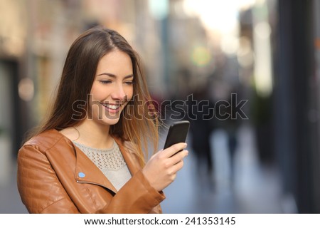 Similar – Image, Stock Photo Smiling woman browsing cellphone in city