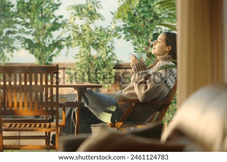 Similar – Image, Stock Photo Woman drinking coffee and on the mobile phone in airport