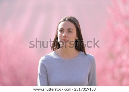 Similar – Image, Stock Photo Serious woman with blooming twigs in garden