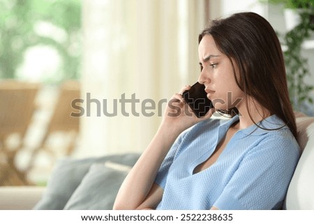 Similar – Image, Stock Photo Woman talking on cell phone and has laptop in hand