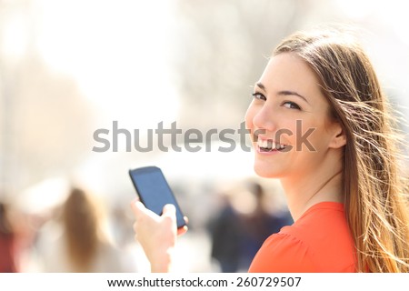 Similar – Image, Stock Photo Woman looking back holding man’s hand on beach