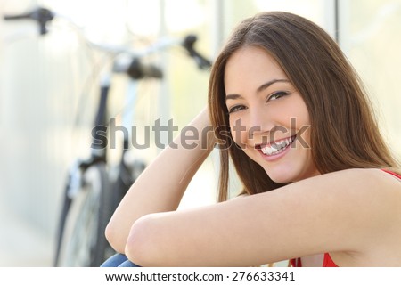 Girl portrait with perfect smile and white teeth looking at camera. Dental care concept