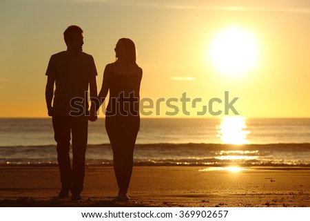 https://image.shutterstock.com/display_pic_with_logo/1020994/369902657/stock-photo-front-view-of-a-full-body-of-a-couple-silhouette-walking-together-on-the-beach-at-sunset-in-summer-369902657.jpg