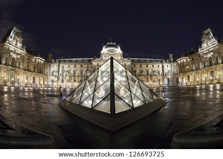 PARIS - JANUARY 01: Louvre Museum on January, 2013 in Paris. The large pyramid was completed in 1989, it has become a landmark of the city of Paris.