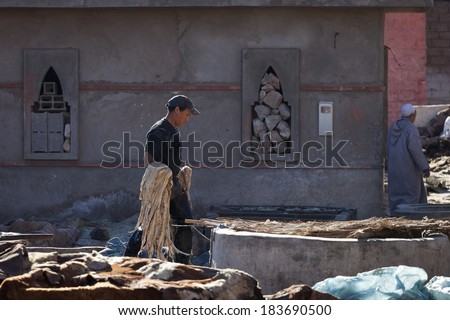 MARRAKECH, MOROCCO - MARCH 6: Workers at leather factory perform the work on March 6, 2014. Tanning production is one of the most ancient in Morocco
