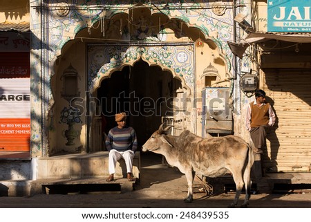 PUSHKAR, INDIA - JAN 08: Indian men on street of Pushkar on January 08, 2015. Agra is a town in the Ajmer district in the Indian state of Rajasthan.