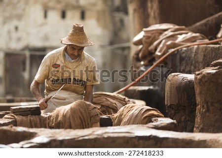 FEZ, MOROCCO - APRIL 19: Workers at leather factory perform the work on April 19, 2015. Tanning production is one of the most ancient in Morocco
