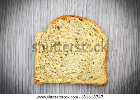 Fresh Tasty Bread on Woody Background