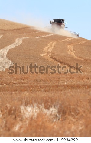 Wheat combine during harvest in Eastern Washington