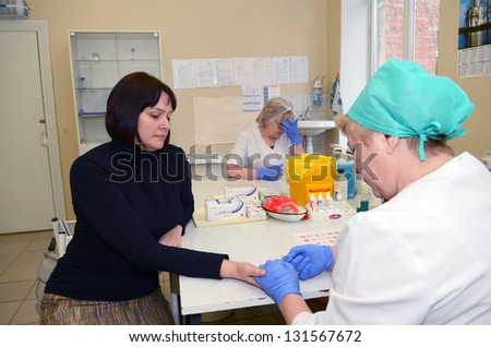 ROSTOV-ON-DON, RUSSIA - March 2:  An unknown donor's blood is tested before donation. The City Blood Service makes a promo action for donorship popularization, March 2, 2013 in Rostov-on-Don, Russia.
