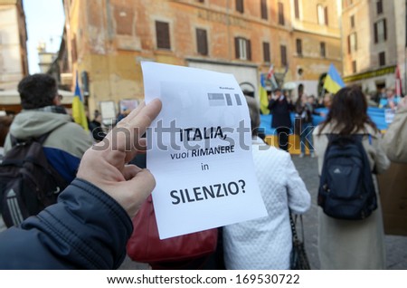ROME, ITALY - DECEMBER 22: Euromaydan in Rome Rotunda Square. Text leaflets read: Italy, you want to be silent?, December 22, 2013 in Rome, Italy