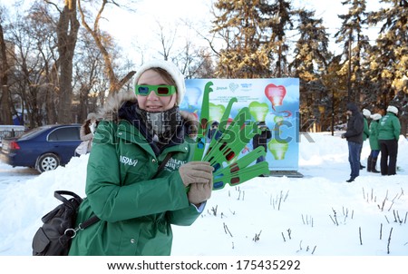 ROSTOV-ON-DON, RUSSIA-February 1: \'The heat of our support\'Â?Â?  holiday in support of the Sochi 2014 Olympics. Volunteer with stereo glasses for guests, February 1, 2014 in Rostov-on-Don, Russia
