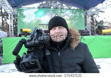 ROSTOV-ON-DON, RUSSIA-February 1: \'The heat of our support\'Â?Â? festival in support of the Sochi 2014 Olympics. TV videoperator, February 1, 2014 in Rostov-on-Don, Russia