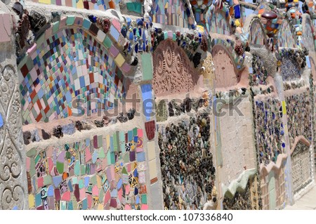 LOS ANGELES, CA - MAY 19: Detail of ceramic shards inlaid in cement at Watts Towers, Los Angeles on May 19, 2012. Simon Rodia used discarded pieces of broken pottery to decorate his towers.