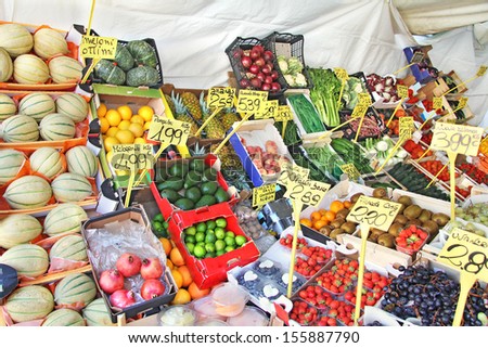 Market with vegetables and fruits for sale on the street in a tent