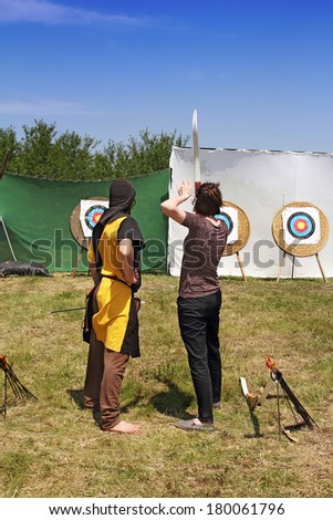 The archers will shoot targets on the lawn