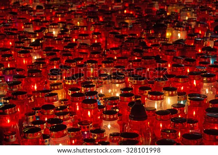 A lot of Candles Burning At a Cemetery During All Saints Day