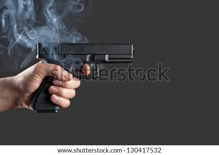 handgun in men hand closeup