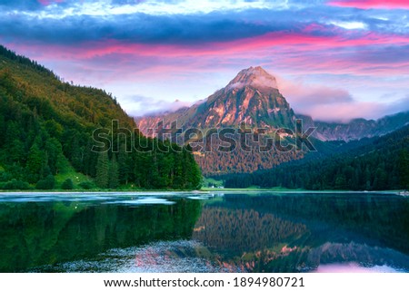 Similar – Image, Stock Photo Clear pond near rocks at sunset