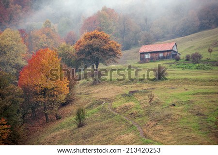alone house in autumn mountain