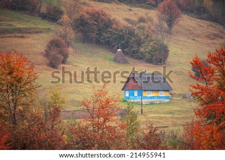 alone house in autumn mountain