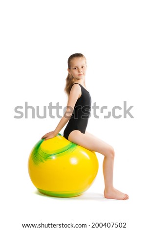 girl gymnast with a yellow ball