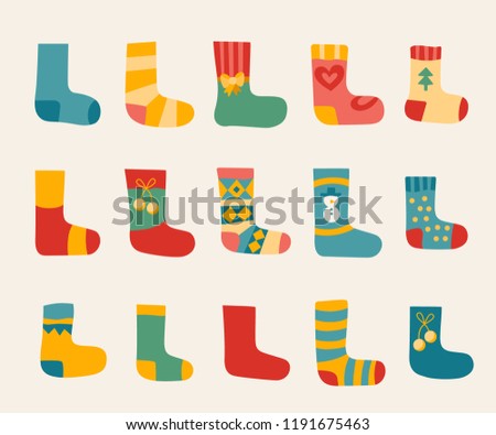 Vector illustration: winter foot clothes: set of 15 blue, red and yellow woolen socks isolated on white background. Decorative elements for Christmas greeting cards, fabrics, wallpaper, wrapping paper