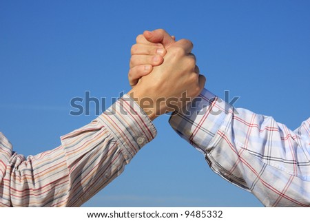 Partner and Friendship: two young man shaking hand