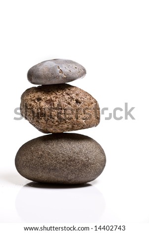 Three stones balanced isolated on white background