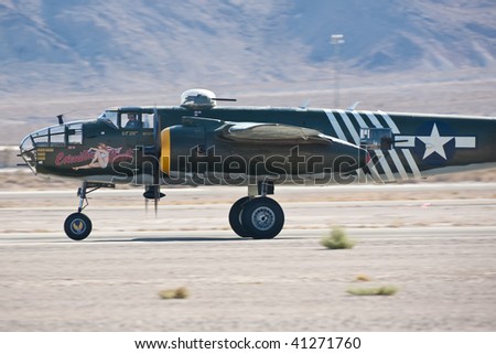 NELLIS AFB, LAS VEGAS, NV - NOVEMBER 14: B-25 Mitchell vintage WWII-era bomber aircraft takes off at Aviation Nation 2009 on November 14, 2009 in Nellis AFB, Las Vegas, NV.