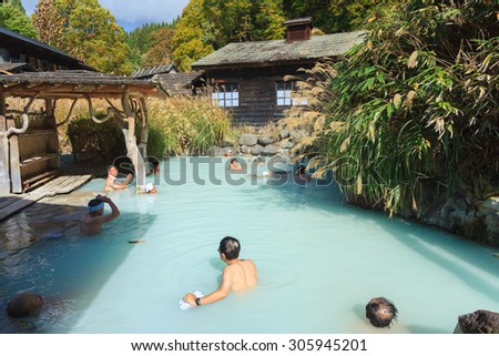 AKITA, JAPAN -OCT 20, 2012: People soaking in outdoor hot spring pool at Tsurunoyu onsen. Tsurunoyu Onsen is one of the oldest hot spring resorts of Nyutou Onsenkyo with a history of over 300 years