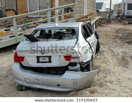 BREEZY POINT, NY - NOVEMBER 15: Destroyed car in the aftermath of Hurricane Sandy on November 15, 2012 in Breezy Point, NY