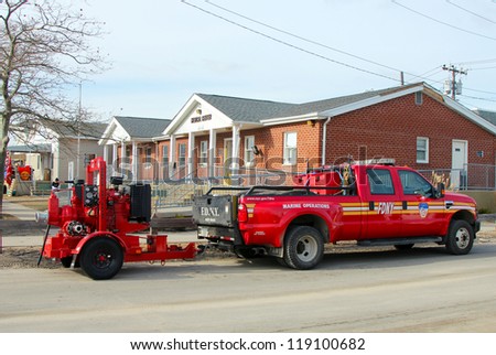 BREEZY POINT, NY - NOVEMBER 15: Fire department marine operations truck with water pump  moved to flooded area in the aftermath of Hurricane Sandy on November 15, 2012 in Breezy Point, NY