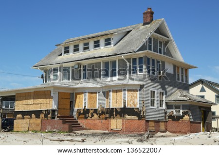 FAR ROCKAWAY, NY - APRIL 25: Destroyed beach house in devastated area six months after Hurricane Sandy on April 25, 2013 in Far Rockaway, NY