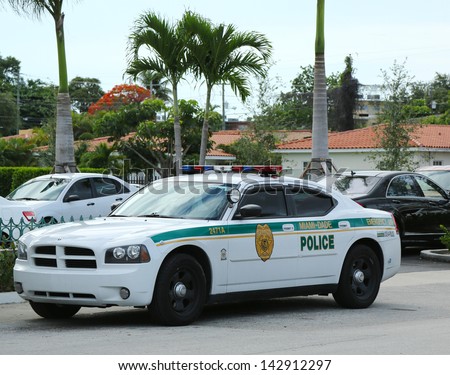 MIAMI, FLORIDA- JUNE 13 :Miami - Dade police department car in South Miami  on June 13, 2013.  Police Department serving Miami-Dade County and has more than 3 thousand officers