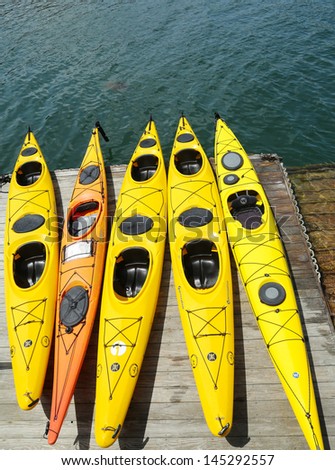 BAR HARBOR, MAINE -  JULY 6: Sea kayaks ready for tourists in Bar Harbor on July 6, 2013.  Bar Harbor is a famous summer colony in the Down East region of Maine